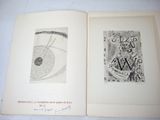 an open book with a drawing of a clock and a drawing of an eye