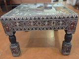a small table with a mirror on top of it