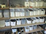many bins and containers on the shelves in the room