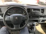 dashboard view of a car with a steering wheel and dashboard controls