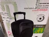 a black suitcase sitting on top of a box on the ground
