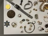 many different types of jewelry displayed on a table
