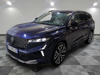 a dark blue suv parked on a checkered floor in a showroom