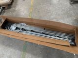 a cardboard box that has a bunch of metal rods in it