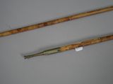 pair of bamboo canes with a stick handle and a stick handle
