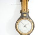 an image of a clock hanging on the wall with an eagle on it