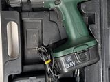 a cordless drill in a box with a cord