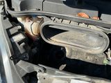 a car engine with a fuel tank in the trunk of it