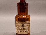 a brown glass bottle with a brown label on it