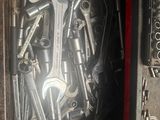 a box full of wrenches and other tools in it