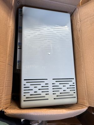 a box with a laptop inside of it on a table