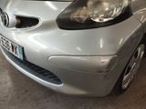 a silver car that is parked in a garage