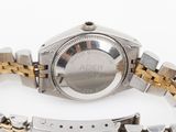 an image of a close up of a watch on a white surface