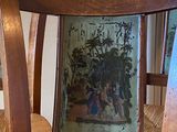 a wooden chair with a picture on the back of it