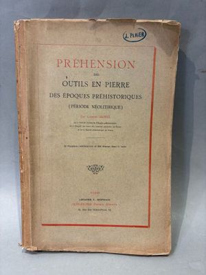 an old book sitting on top of a table on a table