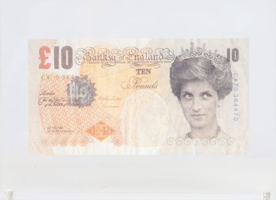 a picture of a british ten pound note in a glass case