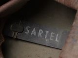 a label on the inside of a bag that says sartell