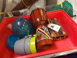 a red tray with a bunch of musical instruments in it