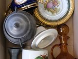 a box filled with different types of vases and plates