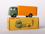 two toy trucks that are sitting on top of a box