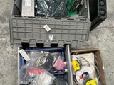 a box of assorted electronics sitting on the ground