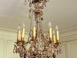 a chandelier hanging from the ceiling in a room