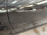 a close up of a door handle on a car