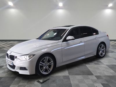 a picture of a white bmw car parked in a showroom