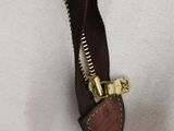 an image of a close up of a zipper on a white shirt