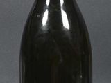 a bottle of wine that is sitting on a table