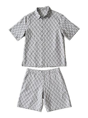 a close up of a shirt and shorts on a white background