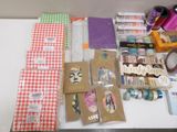 supplies laid out on a table for crafting and sewing