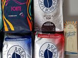several bags of coffee are lined up on a table