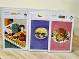 three boxes of food that are on a table