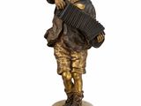 bronze figurine of a boy playing an accordion on a marble base