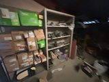 a blurry photo of a room with a lot of boxes on the shelves