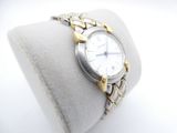 a watch that is sitting on top of a bracelet