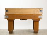 a wooden table with a drawer on top of it
