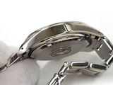 a close up of a watch on a white surface