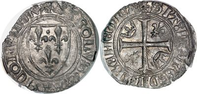 a silver coin with an image of a cross on it