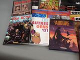 a lot of comic books sitting on a table