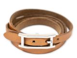 a close up of a brown leather belt with a silver buckle