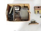a box with a toy train and other items on the table