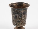 a vase that is sitting on a white surface