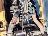 a large engine that is sitting in the back of a truck