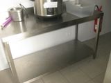a stainless steel table with a blender on top of it