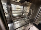a stainless steel oven that has a rack in it