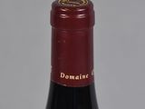 a bottle of wine that is sitting on a table