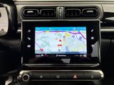 the dashboard of a car with a gps device in the center