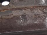 a close up of a piece of metal with a hole in it
